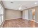 Main bedroom with laminate flooring and ensuite bathroom access at 8009 Applehill Ct, Orlando, FL 32810