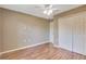 Spacious bedroom with wood floors and double closets at 8009 Applehill Ct, Orlando, FL 32810