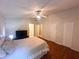 Bright bedroom with wood floors and ceiling fan at 8009 Applehill Ct, Orlando, FL 32810