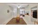 Bright dining area with wood-look flooring and view into living room at 8009 Applehill Ct, Orlando, FL 32810