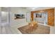 Cozy dining area with wood-look flooring and adjacent kitchen at 8009 Applehill Ct, Orlando, FL 32810