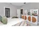 Charming bedroom features a decorated cabinet, bed with plush pillows, and neutral decor at 9665 Sw 125 Ter, Dunnellon, FL 34432