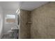 Clean bathroom with shower, toilet and pedestal sink at 2313 Savoy Dr, Orlando, FL 32808
