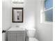 Simple bathroom with vanity, toilet and window at 2313 Savoy Dr, Orlando, FL 32808