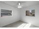 Spacious bedroom with two windows and tile floors at 2313 Savoy Dr, Orlando, FL 32808