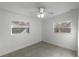 Well-lit bedroom featuring two windows and tile floors at 2313 Savoy Dr, Orlando, FL 32808