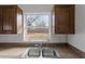 Kitchen sink and countertop with backyard view at 2313 Savoy Dr, Orlando, FL 32808