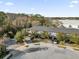 Aerial view of townhomes featuring private drives surrounded by green trees at 4457 Le Reve Ct, Kissimmee, FL 34746