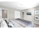 Bright bedroom features a large window, queen bed and a modern ensuite bathroom at 4457 Le Reve Ct, Kissimmee, FL 34746