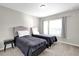 Neutral bedroom featuring two twin beds, a window for natural light, and a minimalist design at 4457 Le Reve Ct, Kissimmee, FL 34746