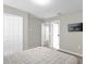 Cozy bedroom featuring neutral decor, double closets, and ample natural light at 4457 Le Reve Ct, Kissimmee, FL 34746