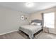 Cozy bedroom featuring neutral tones, natural light and a comfortable bed at 4457 Le Reve Ct, Kissimmee, FL 34746
