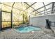 Enclosed hot tub featuring a relaxing waterfall feature and a private outdoor space at 4457 Le Reve Ct, Kissimmee, FL 34746