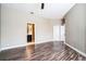 Spacious bedroom featuring laminate flooring, ample closet space, and an ensuite bathroom at 7700 Carriage Homes Dr # 4, Orlando, FL 32819