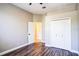 Bright bedroom with wood floors and neutral walls, offering a welcoming and adaptable space at 7700 Carriage Homes Dr # 4, Orlando, FL 32819