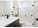 Contemporary bathroom boasts a walk-in shower, a glass enclosure, and a sleek vanity with matte black hardware at 777 Halifax Ave, Winter Park, FL 32792