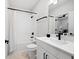 Modern bathroom featuring clean, white fixtures, including a tub with a shower and matte black accents at 777 Halifax Ave, Winter Park, FL 32792