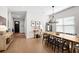 Bright dining room featuring a long wood table and modern chandelier at 777 Halifax Ave, Winter Park, FL 32792