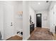 Inviting entryway with a built-in bench, storage cubbies, and a decoratively appointed console table at 777 Halifax Ave, Winter Park, FL 32792