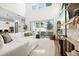 Bright living room with high ceilings and sliding glass doors to the patio at 777 Halifax Ave, Winter Park, FL 32792