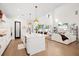 Bright, open-concept living space with kitchen island, modern lighting, and seamless flow to the living room at 777 Halifax Ave, Winter Park, FL 32792