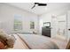 Cozy main bedroom with natural light and an ensuite bathroom, complete with a ceiling fan for added comfort at 777 Halifax Ave, Winter Park, FL 32792