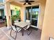 Cozy patio with outdoor seating, lush landscaping and access to the home at 8033 Surf St, Kissimmee, FL 34747