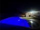 Inviting blue pool with a relaxing nighttime ambiance at 804 Starke Lake Cir, Ocoee, FL 34761