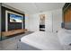 Bedroom featuring a TV and a view into the connected bathroom at 836 Desert Mountain Ct, Reunion, FL 34747