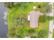 Aerial view of a home on a large lot with mature trees near the lake, offering serene natural surroundings at 119 Lake Dr, Oviedo, FL 32765