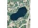 Aerial view of lake surrounded by lush greenery, showcasing the property's serene and secluded location at 119 Lake Dr, Oviedo, FL 32765