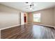 Bedroom with hardwood floors and a large window overlooking the yard at 119 Lake Dr, Oviedo, FL 32765