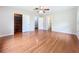 Bedroom featuring hardwood floors and multiple closets at 119 Lake Dr, Oviedo, FL 32765