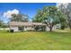 Charming single story home featuring a well-manicured lawn and a inviting entrance at 119 Lake Dr, Oviedo, FL 32765