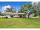 Charming single-story home with manicured lawn and mature trees at 119 Lake Dr, Oviedo, FL 32765