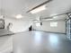 Spacious garage with sealed floors, abundant lighting, and utility access at 119 Lake Dr, Oviedo, FL 32765