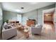 Inviting living room area with cozy seating, a functional wet bar, and ample space at 119 Lake Dr, Oviedo, FL 32765