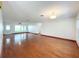 Spacious living room with wood floors, ceiling fan, and bright natural light through a picture window at 119 Lake Dr, Oviedo, FL 32765