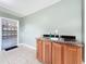 Well-lit mud room with a utility sink and easy access to the garage at 119 Lake Dr, Oviedo, FL 32765