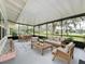 Relaxing screened porch with comfortable seating and serene views of the lush surroundings at 119 Lake Dr, Oviedo, FL 32765
