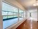 Bright sunroom with large windows offering views of the backyard, creating a serene and relaxing atmosphere at 119 Lake Dr, Oviedo, FL 32765