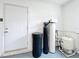 Interior showcasing a water filtration system with a white door and a modern design against a white brick wall at 119 Lake Dr, Oviedo, FL 32765