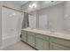 Bathroom boasts a double vanity and a bathtub at 15583 Hamlin Blossom Ave, Winter Garden, FL 34787