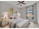 Guest bedroom with stylish decor and a ceiling fan at 15583 Hamlin Blossom Ave, Winter Garden, FL 34787