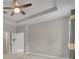 Well-lit bedroom with carpet, ceiling fan, and ample closet space at 15583 Hamlin Blossom Ave, Winter Garden, FL 34787