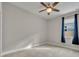 Well-lit bedroom featuring neutral walls and carpet at 15583 Hamlin Blossom Ave, Winter Garden, FL 34787