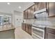 Modern kitchen with stainless steel appliances and granite countertops at 15583 Hamlin Blossom Ave, Winter Garden, FL 34787