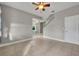 Spacious living room featuring tile floors and a ceiling fan at 15583 Hamlin Blossom Ave, Winter Garden, FL 34787