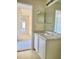 Simple bathroom with vanity and view of hallway at 3040 Jollett Ct, Deltona, FL 32738