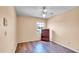 Bedroom with wood-look floors, ceiling fan, and a lovely view of the outdoors at 1000 Manigan Ave, Oviedo, FL 32765